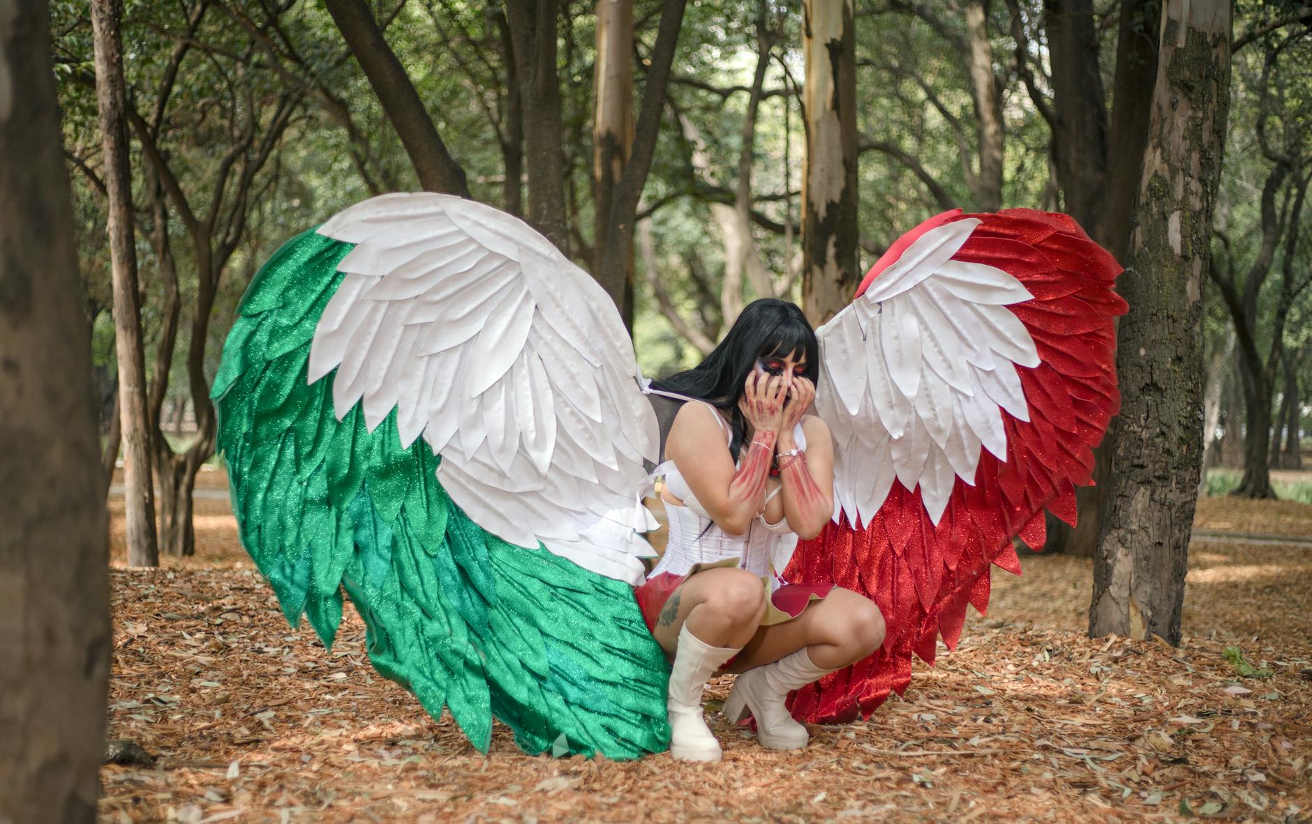 a woman wearing a costume with tricolor angel wings